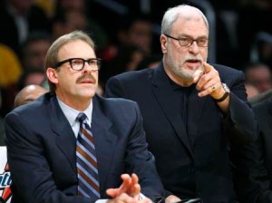 Los Angeles Lakers assistant coach Rambis sits with coach Jackson during their NBA game against the Boston Celtics in Los Angeles